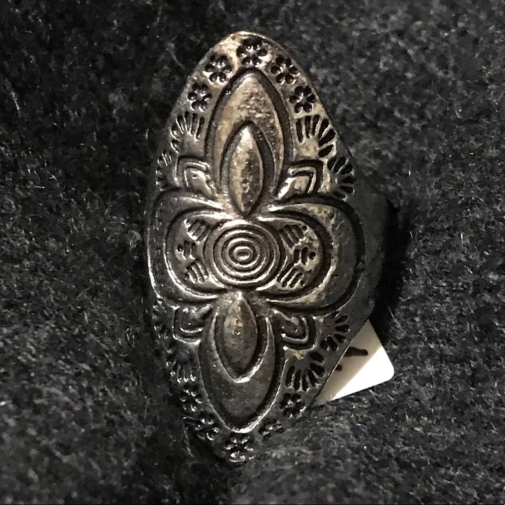 Silver colored “cross” ring